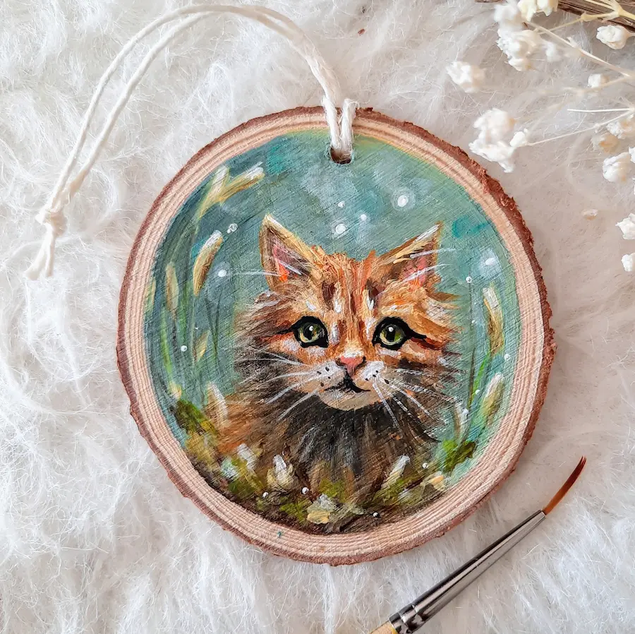 Handpainted treeslice of a red cat